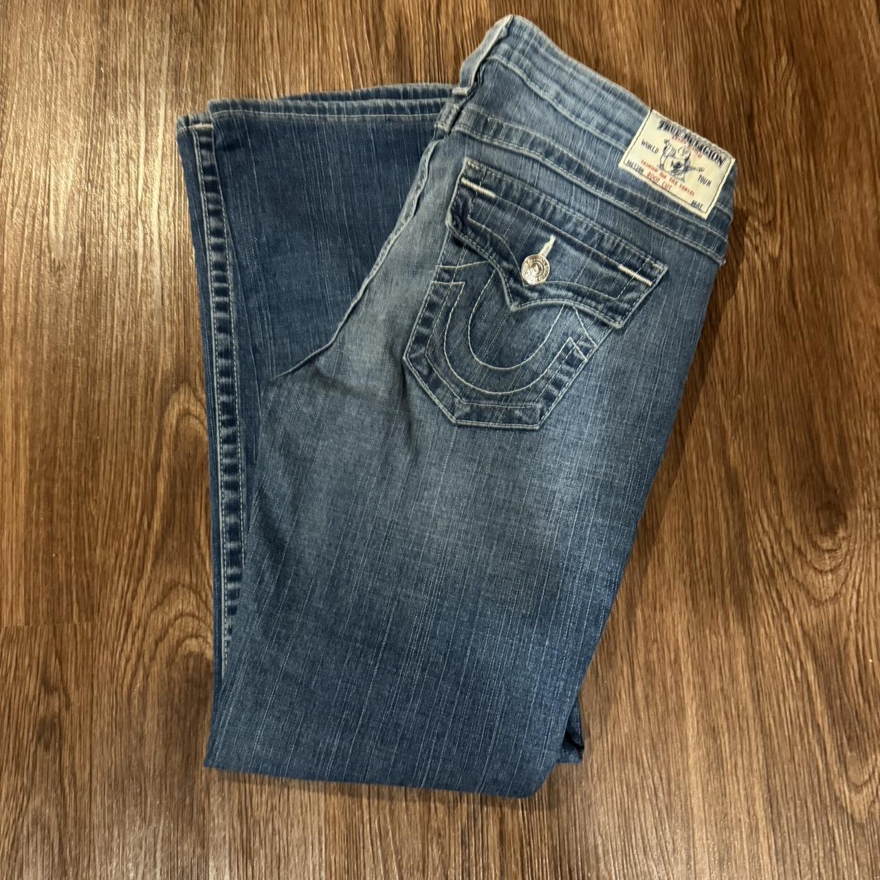 Blue true religion fashion jeans with white stitching