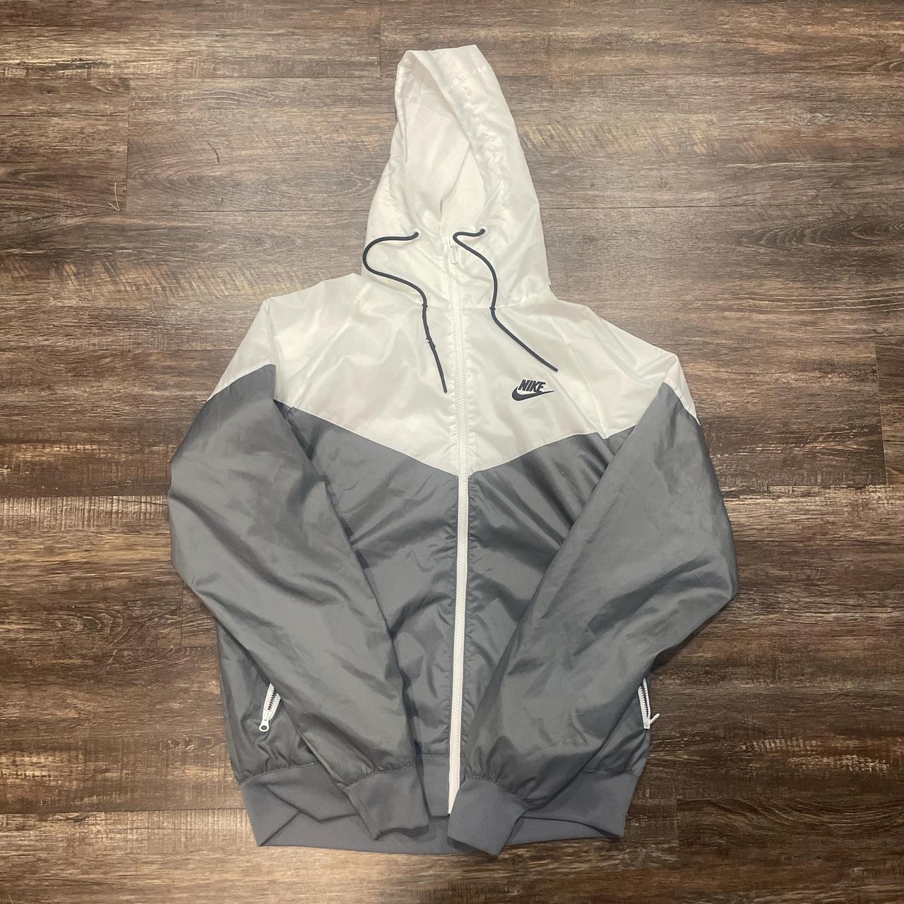 grey and white windbreaker nike