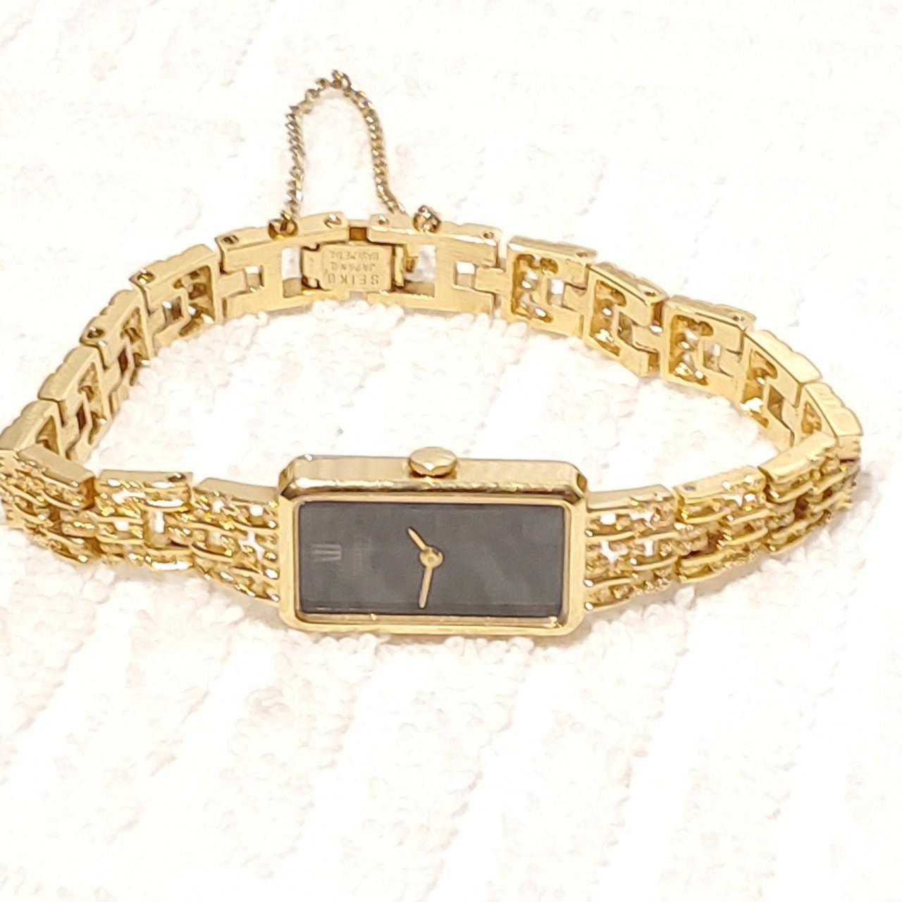 Seiko Women's Black and Gold Watch Depop