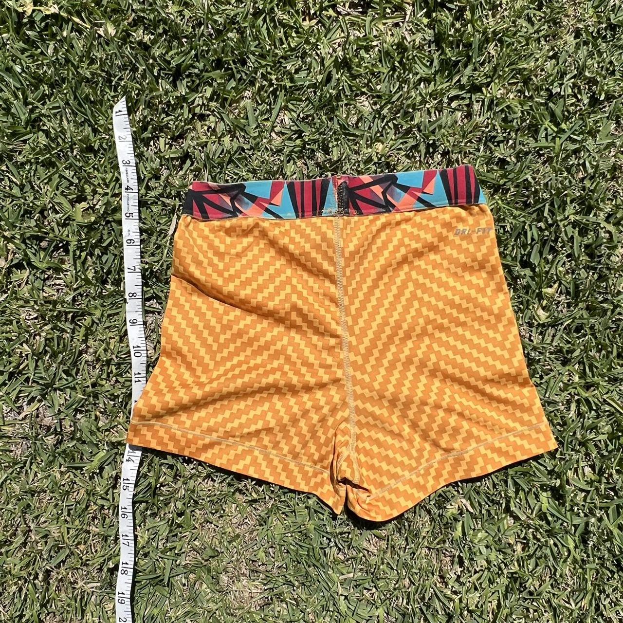 black and orange nike pro shorts