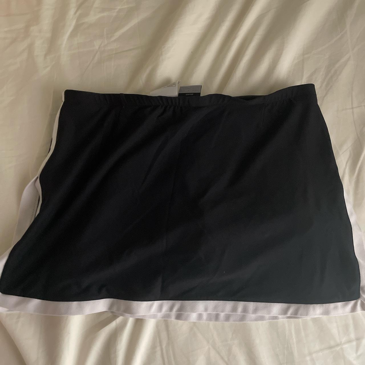Vintage nike tennis skirt black with white stripes... Depop