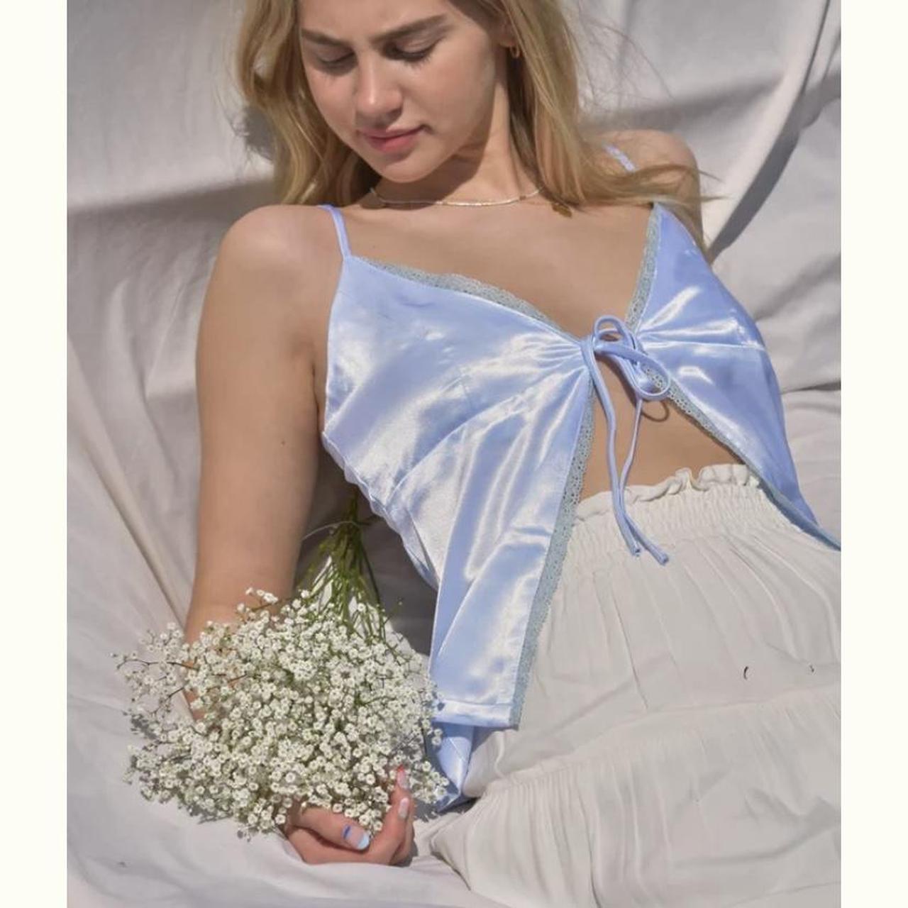 baby blue satin tie front top with lace edging. from... Depop