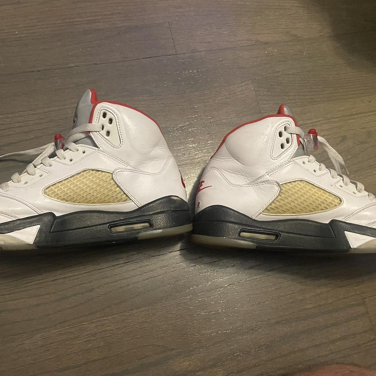 michael jordan wearing jordan 5 fire red