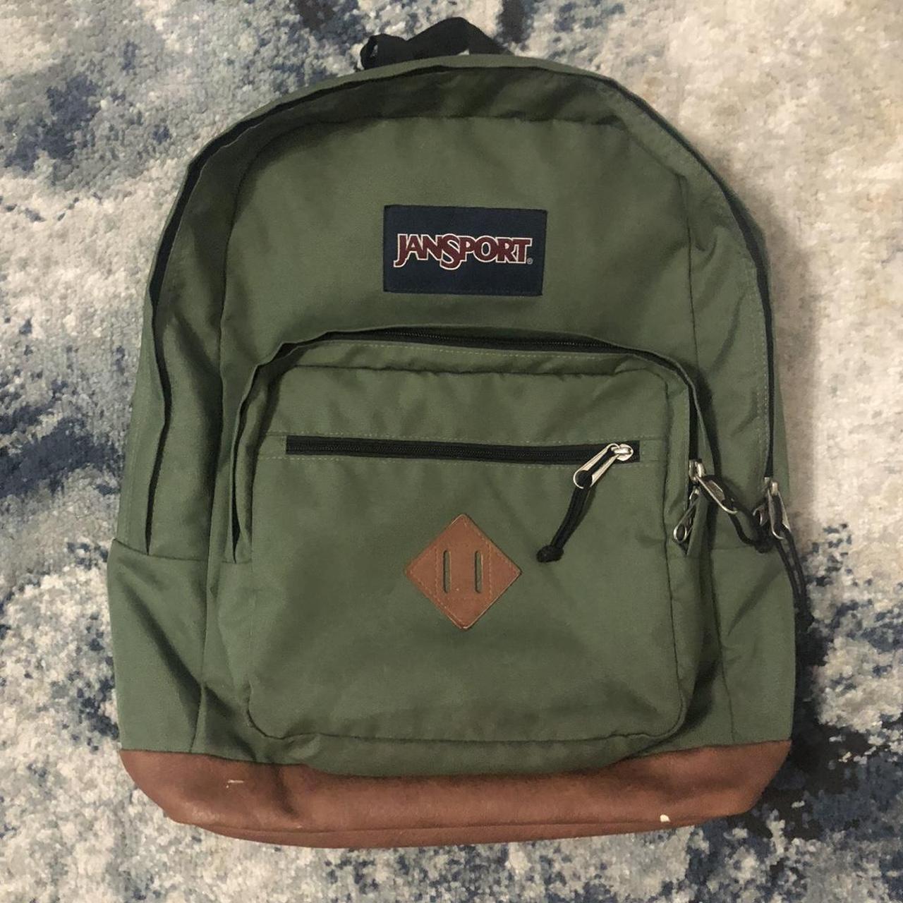 olive green and leather Jansport backpack, some... - Depop