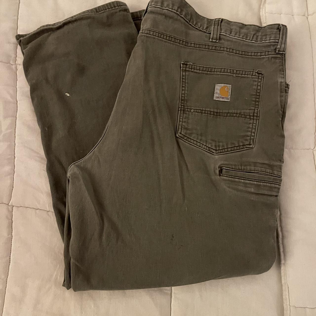 Carhartt work pants 48x30, there is wear and a tear... Depop