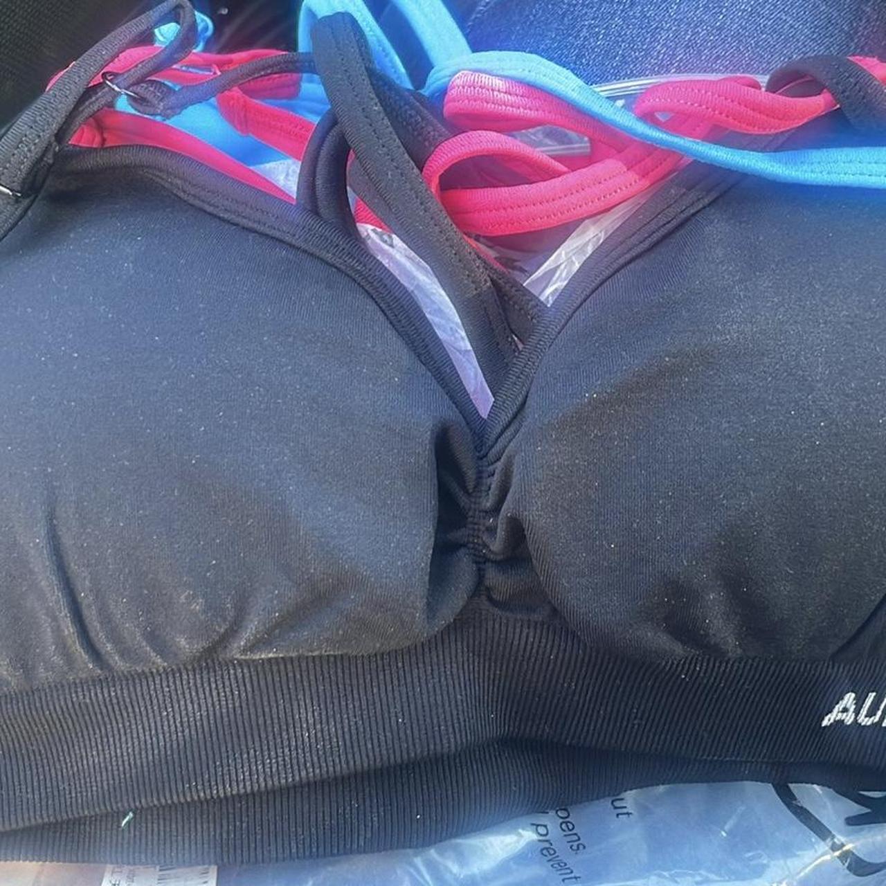 2 pack Aurola Mercury sports bras. Black pink and blue. - Depop