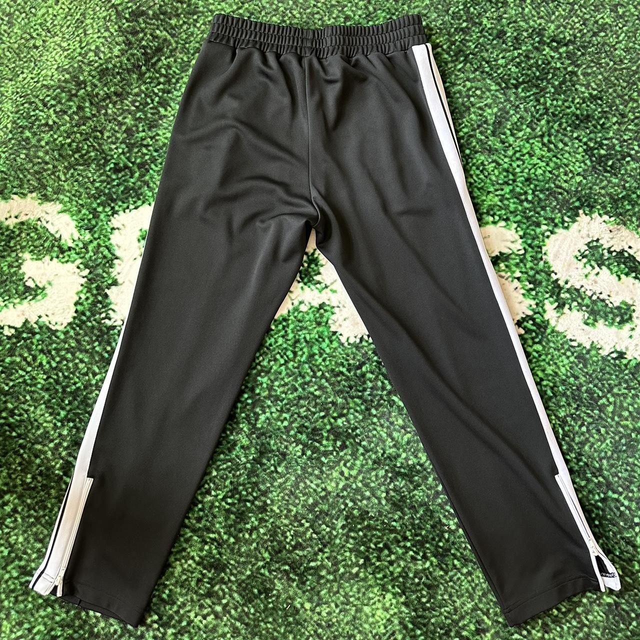 XL. Authentic. Classic palm angels track pants.... Depop