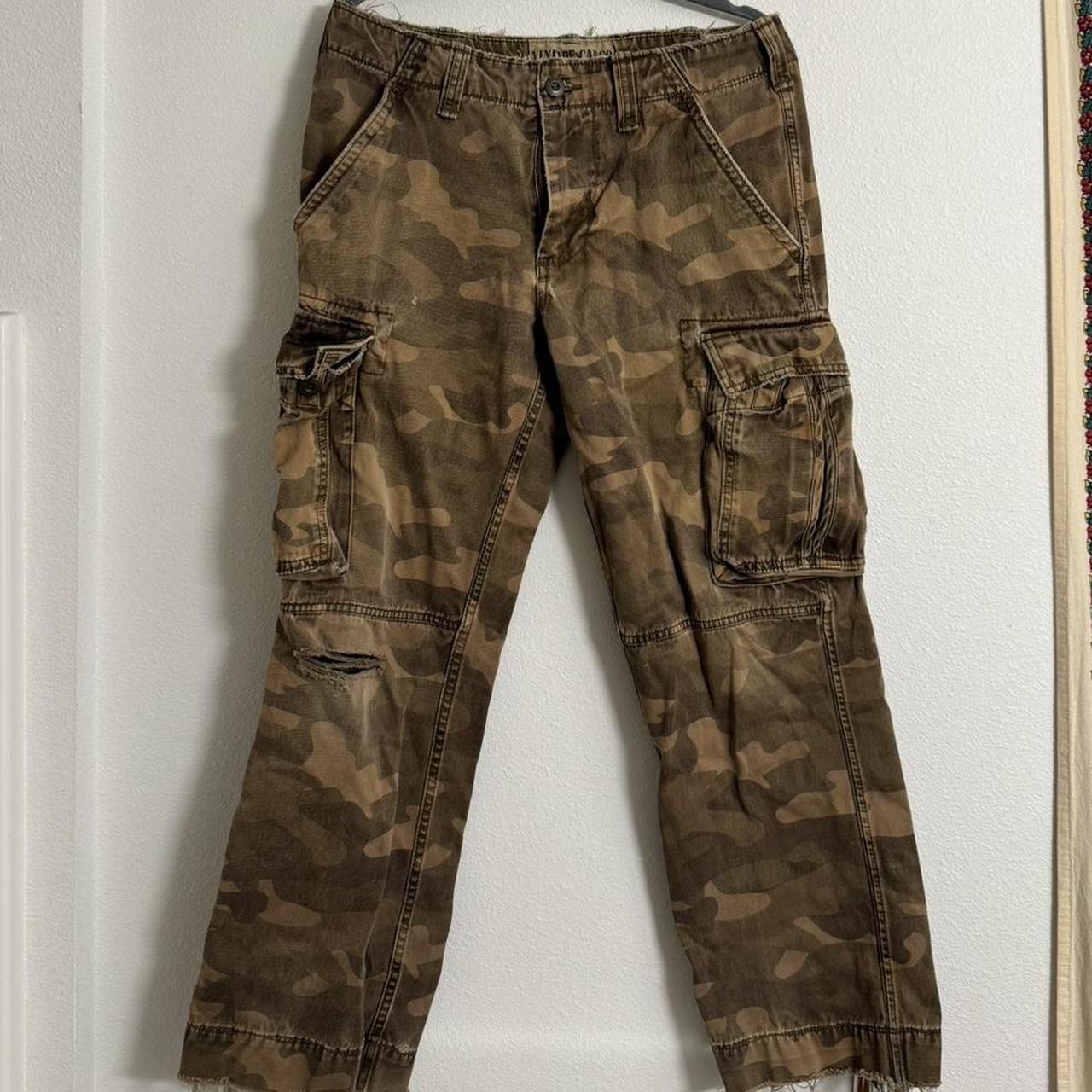 Cargo camo pants with a great fade and wear + tear - Depop
