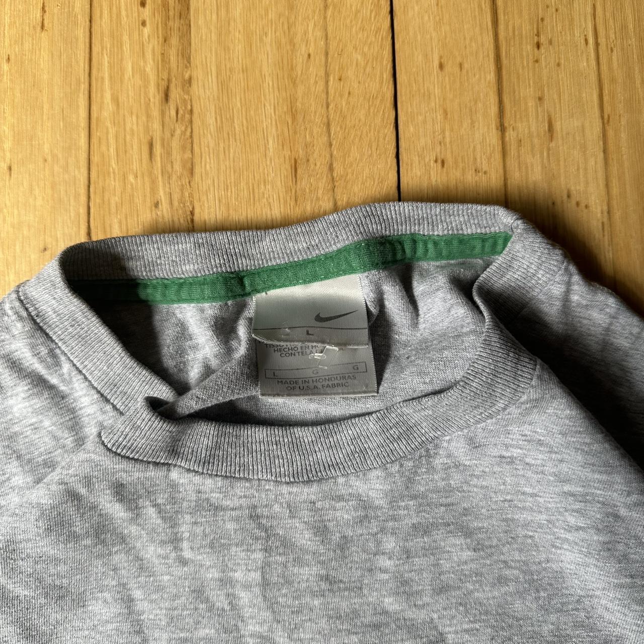 green and gray nike shirt