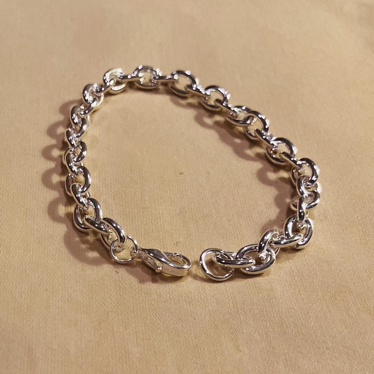 This is a Charm Bracelet in Bright Silver. It’s... - Depop