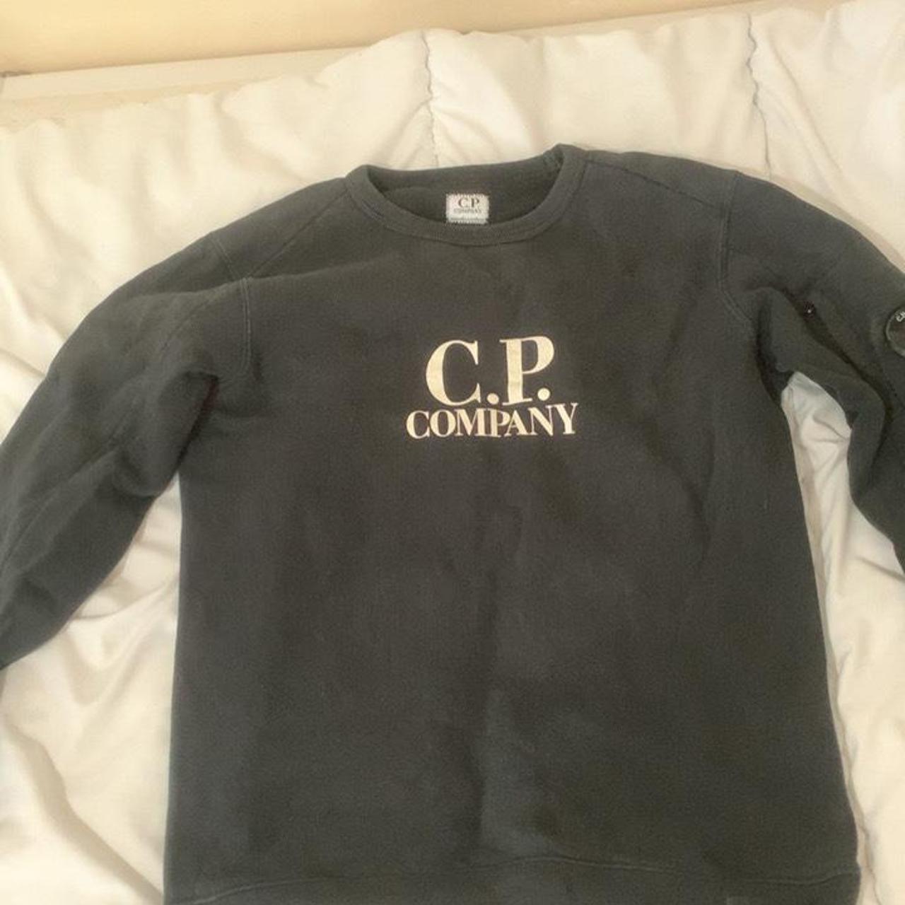 Black cp company jumper bit worn out but still has... - Depop