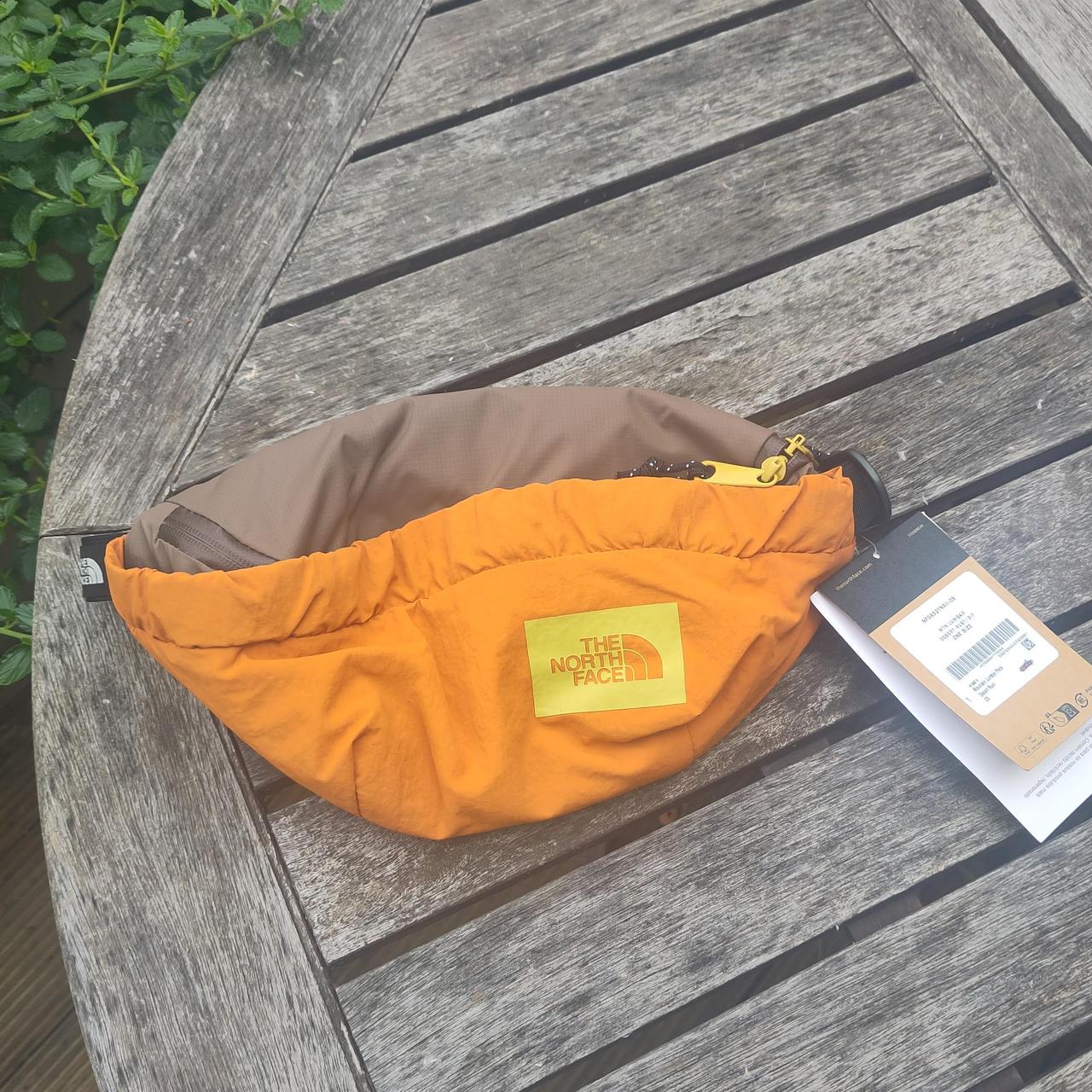 Orange north face bum bag on sale