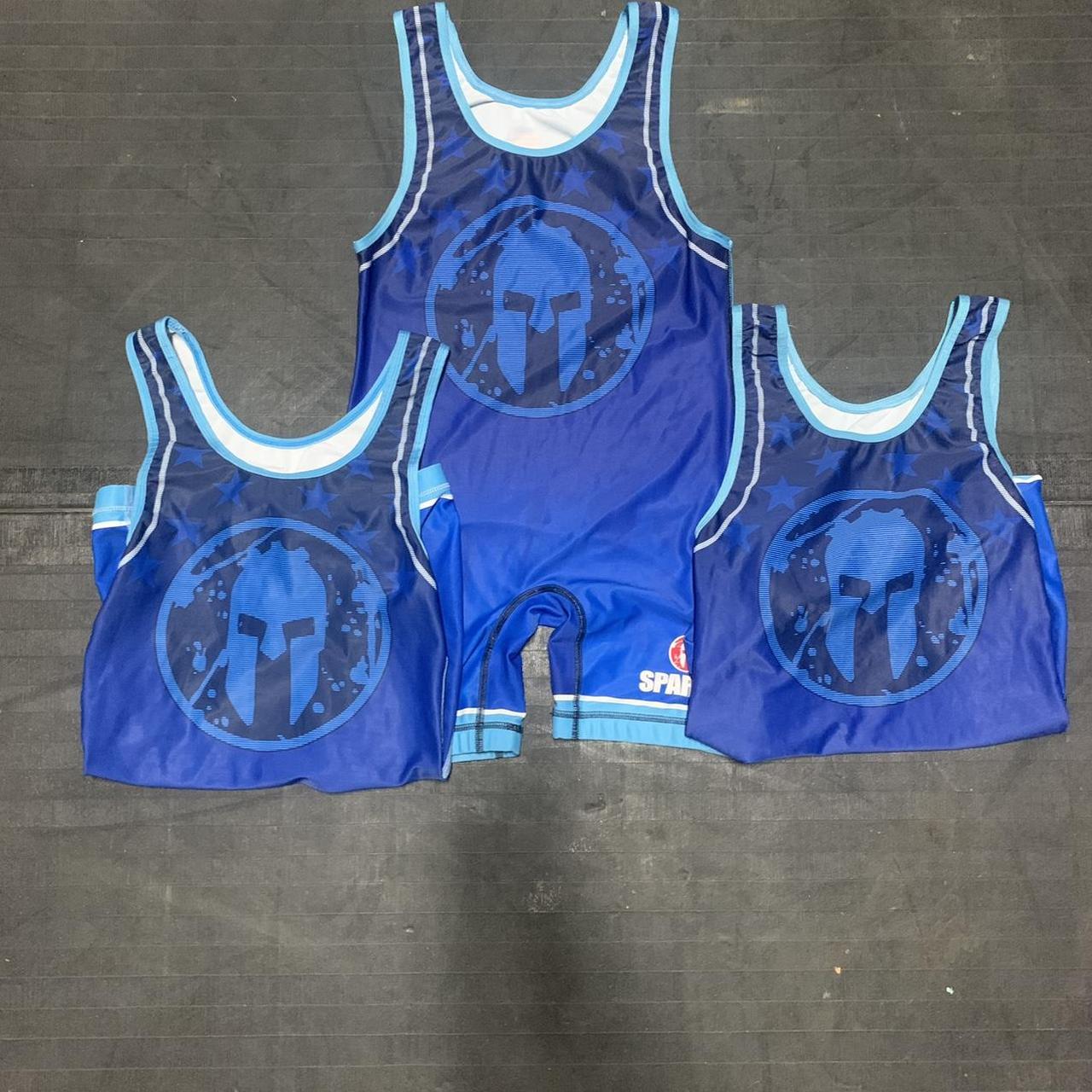 3 Spartan singlets two are size adult small and one... Depop