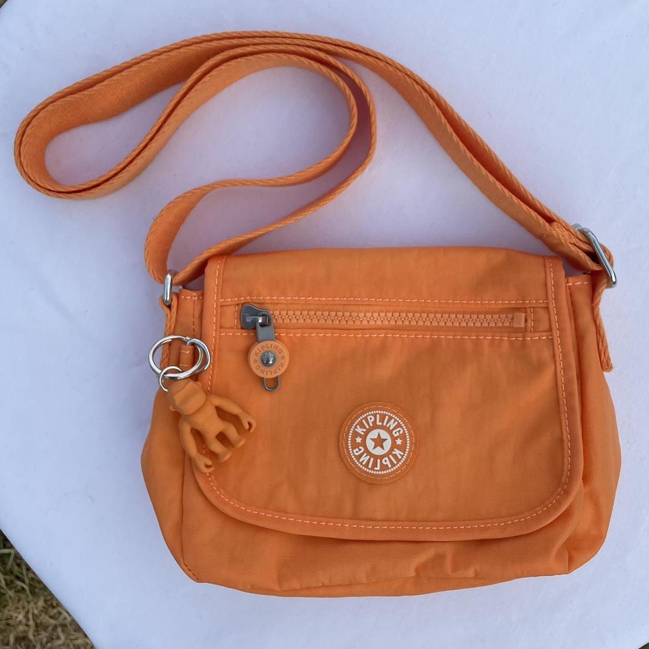 Bright orange Kipling crossbody bag. Small in size,... Depop