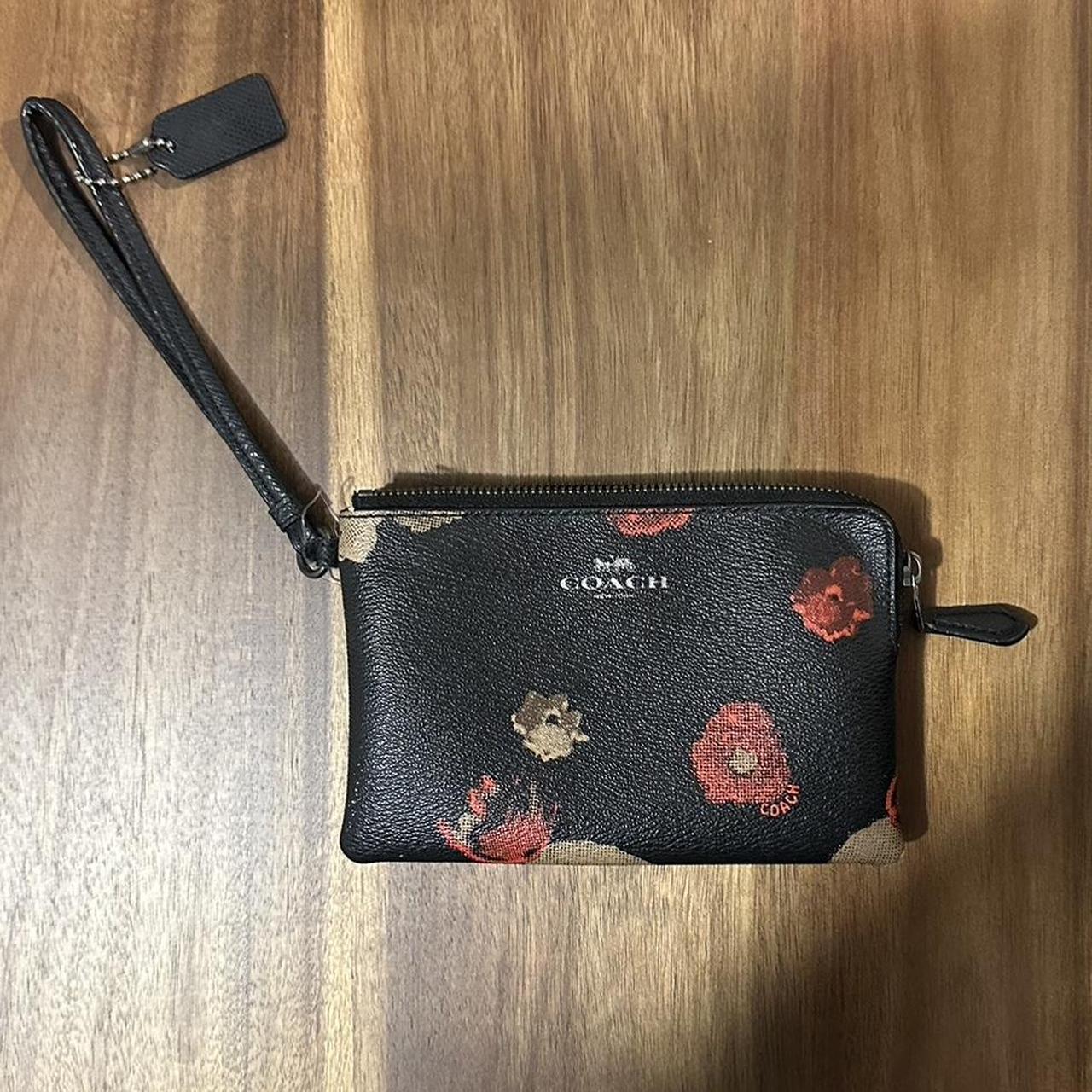 On sale Coach black floral Wristlet