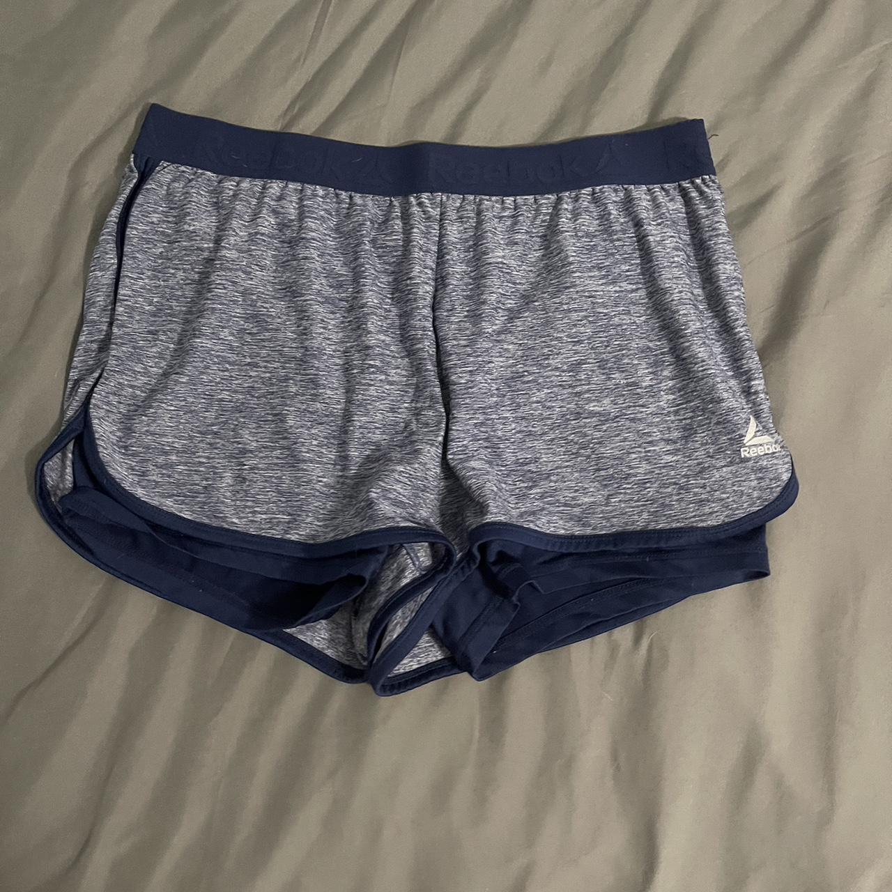 Reebok shorts with spandex connected. The elastic is - Depop