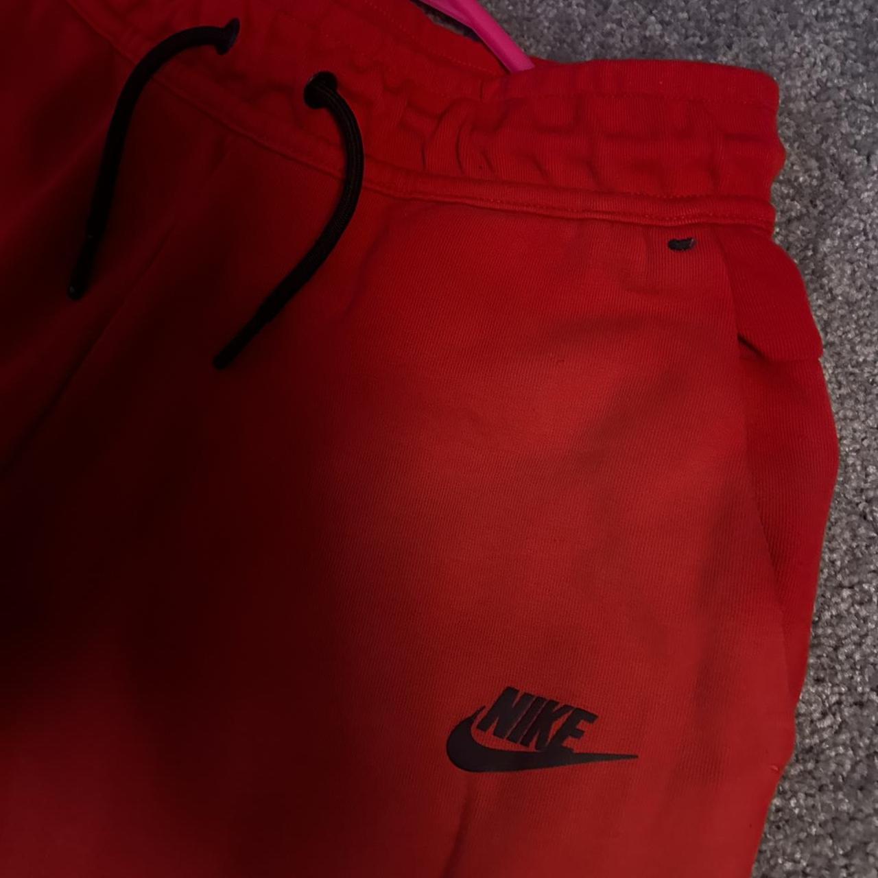 red nike tech pants