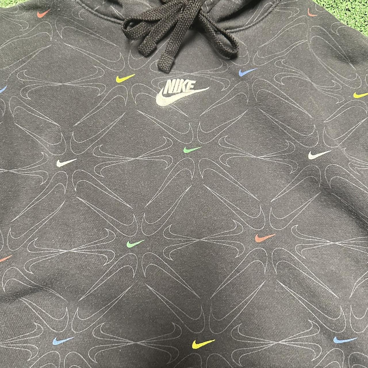 Nike All-over swoosh print hoodie in black