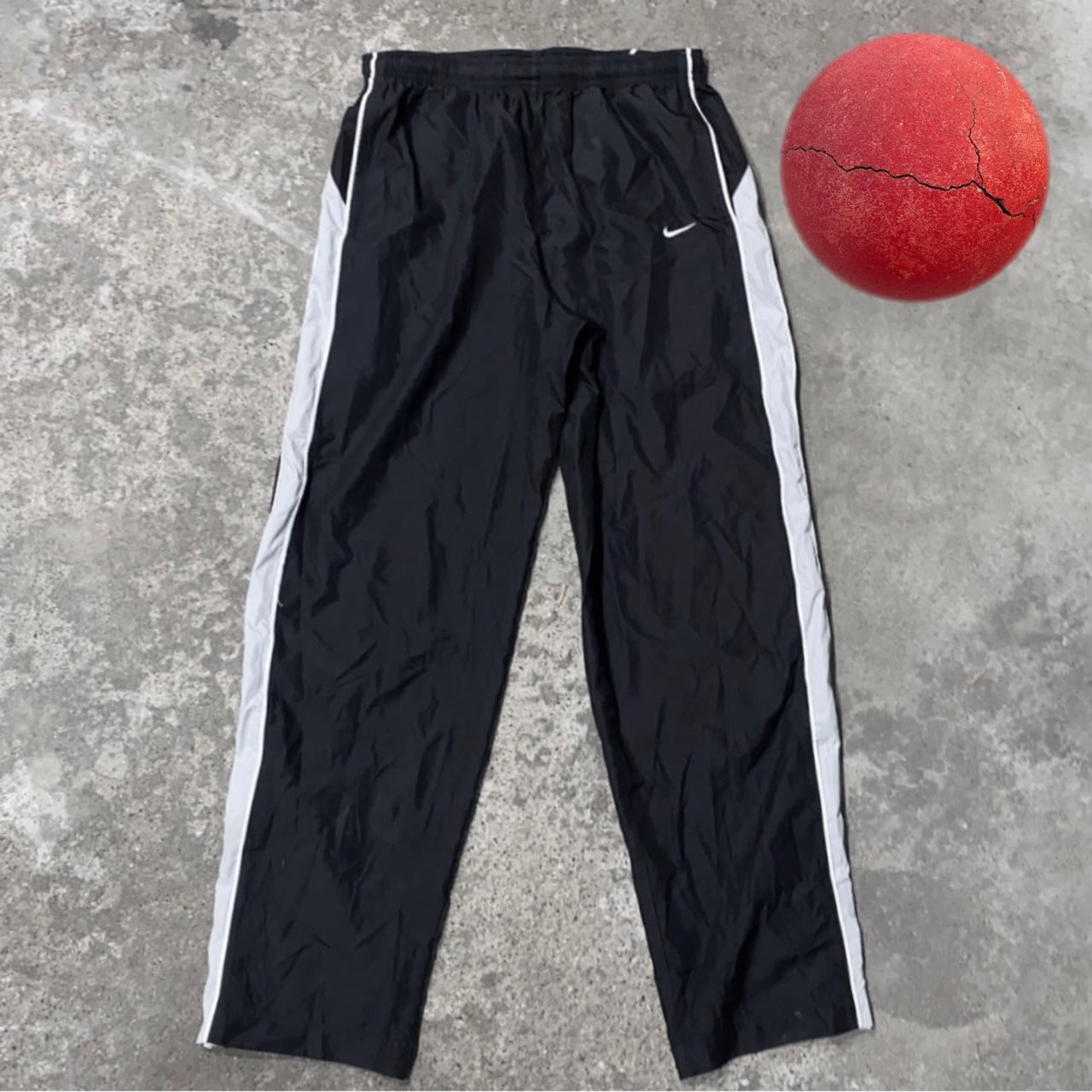 2000’s nike track pants white stripes Inside is... - Depop