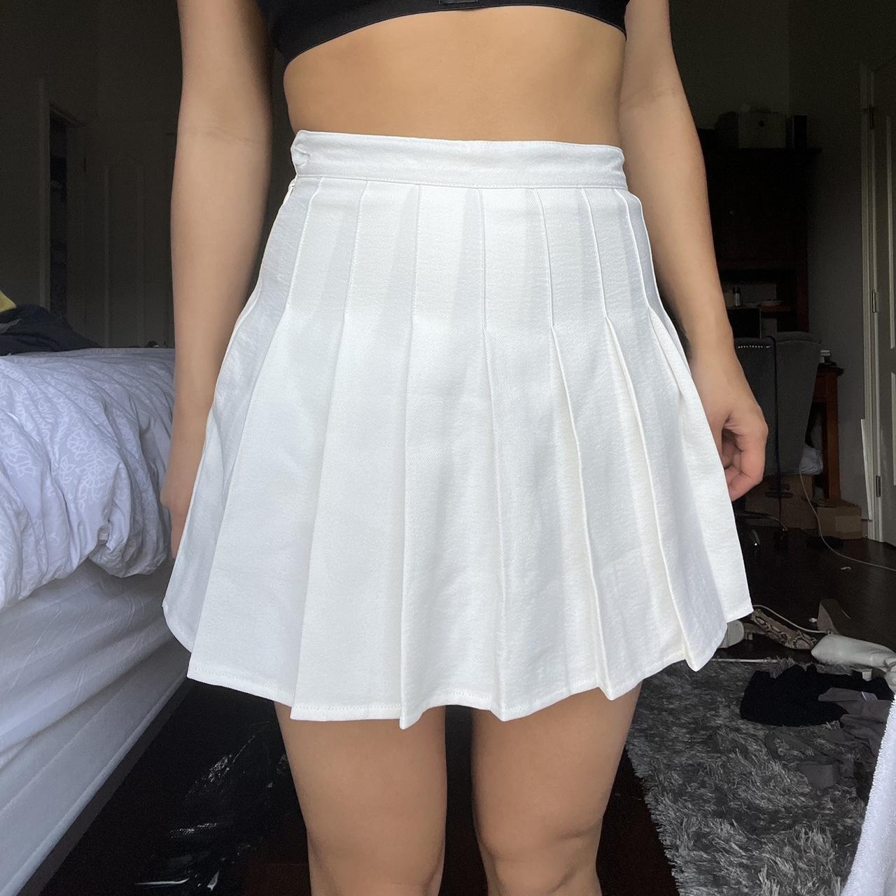 pleated white skirt never worn has button and... - Depop