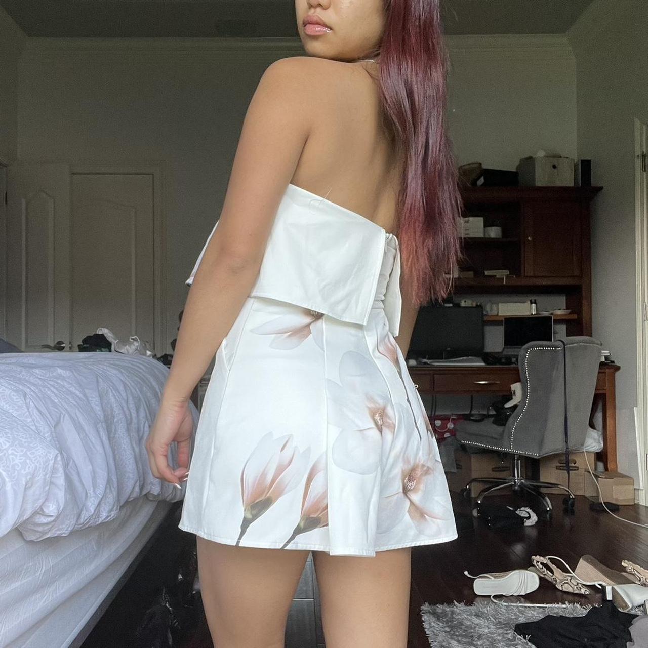 strapless floral romper has the rubber lining so... - Depop