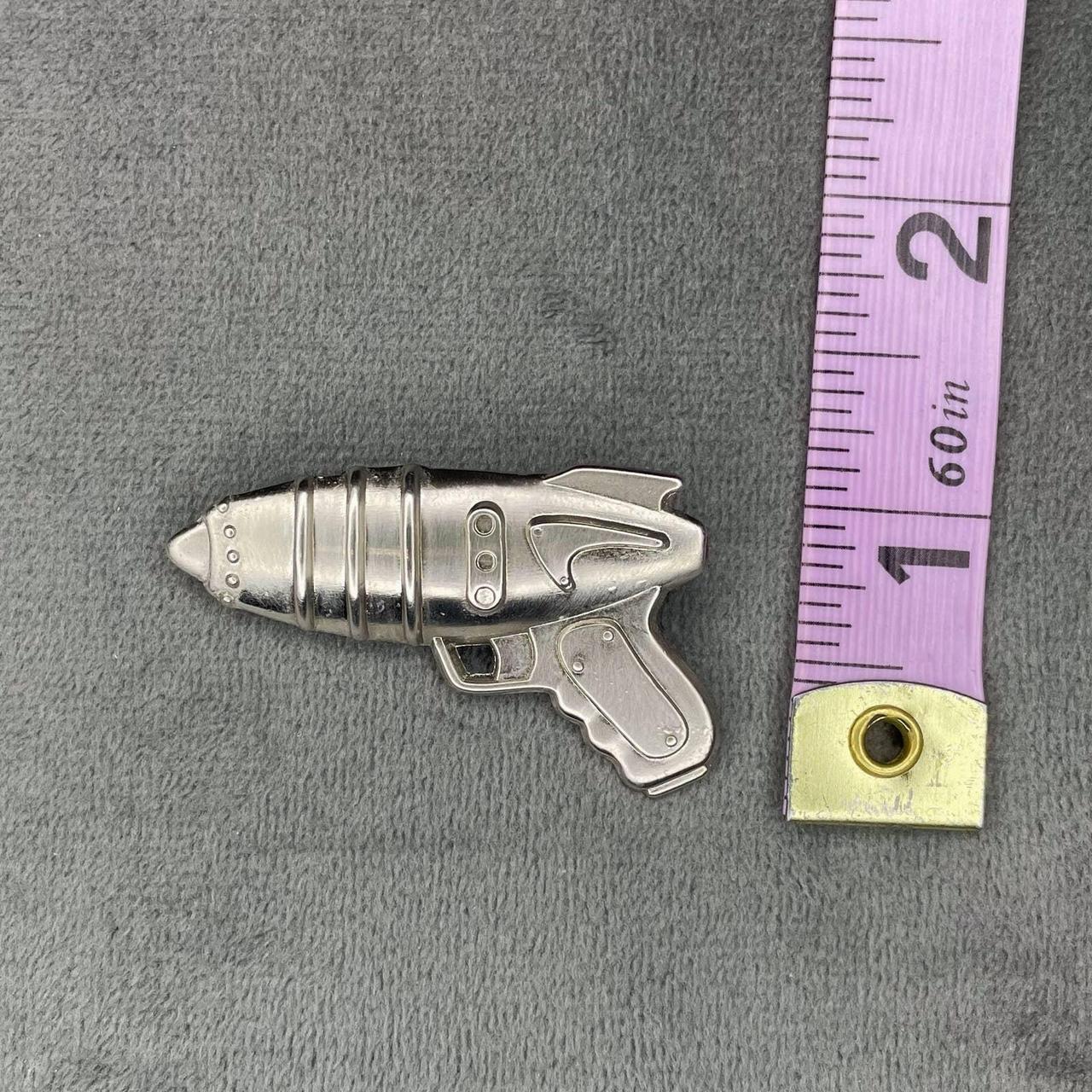Vintage novelty pin of a retro style scifi ray gun.... Depop