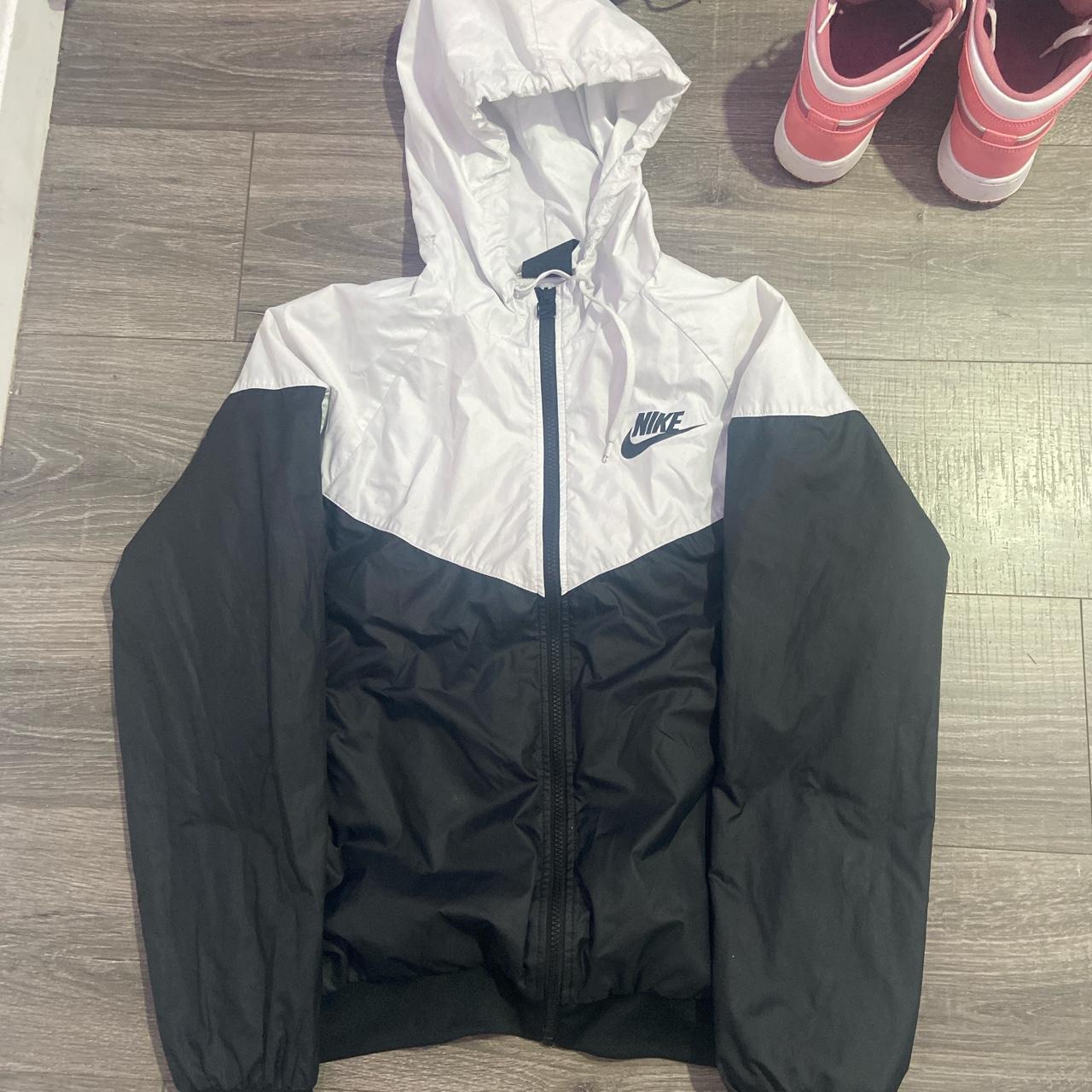 Black and white nike rain jacket Small tear in hood... - Depop