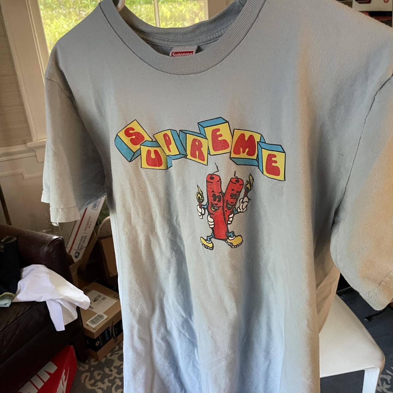 Supreme Dynomite Tee Light Blue Used, cracking as... - Depop