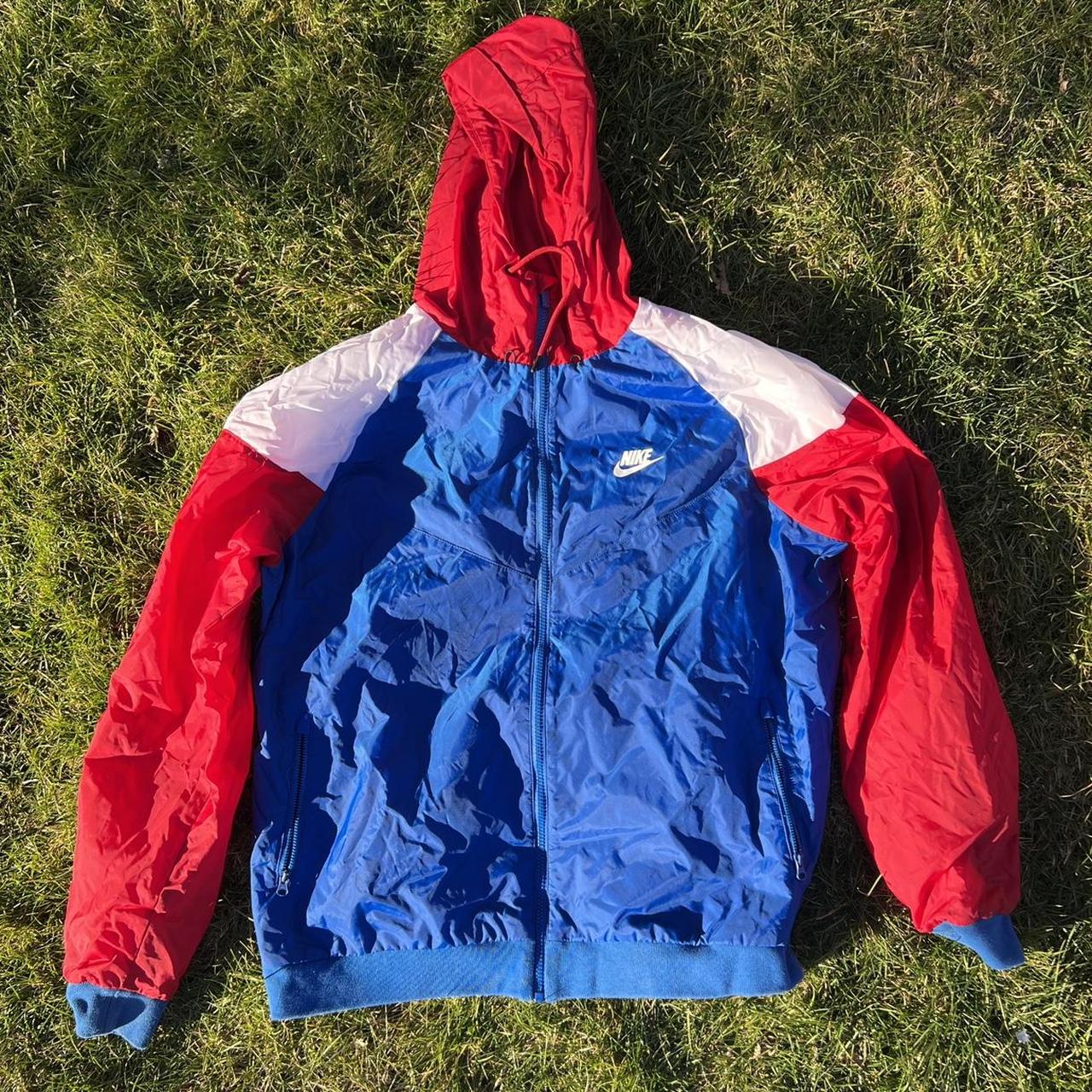 Red white shops and blue nike windbreaker