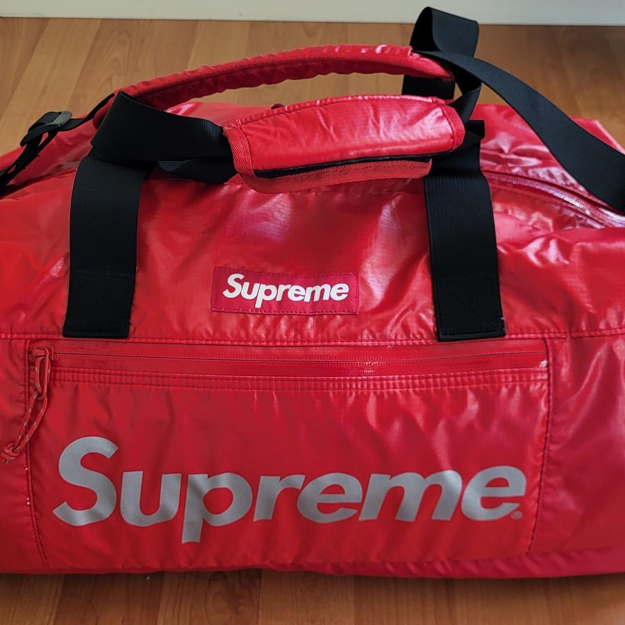 Supreme logo reflective duffel bag 8/10 condition, - Depop