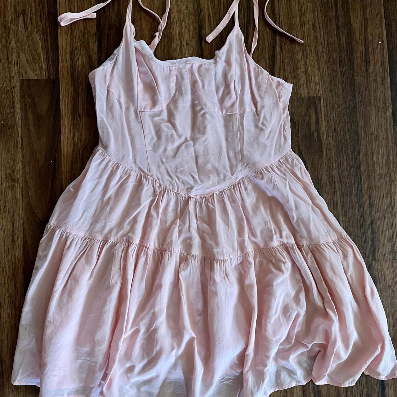 Baby pink mini dress with tie string straps from... - Depop