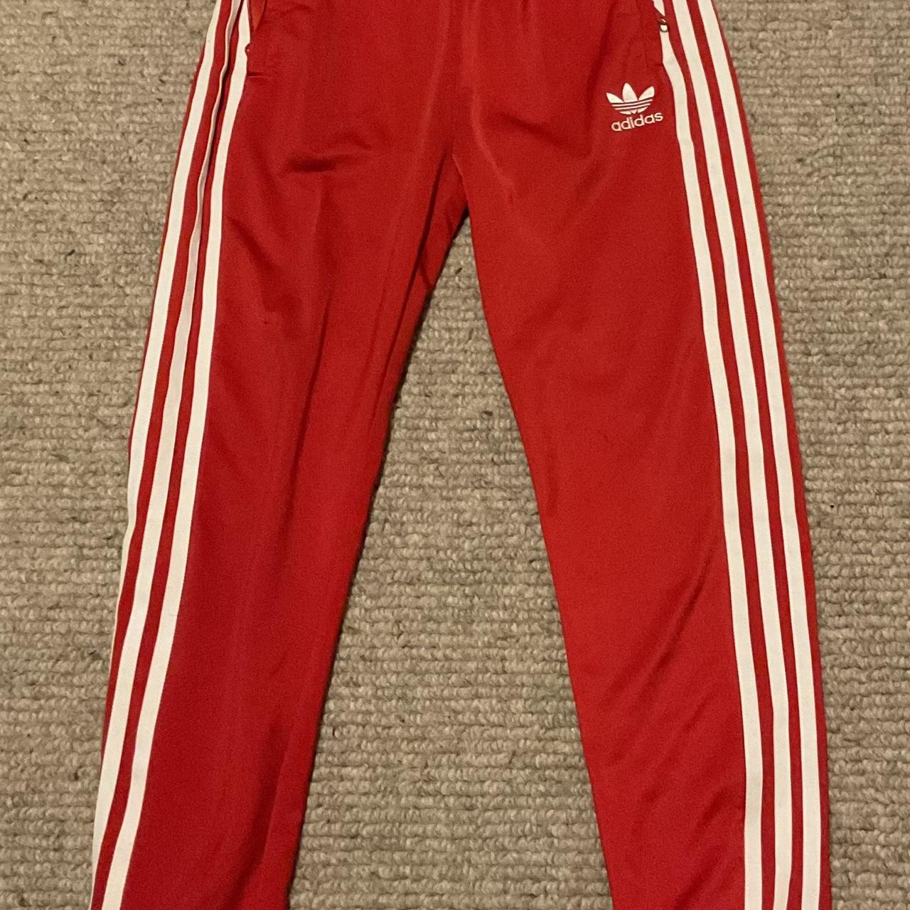 Red sst adidas tracksuit bottoms. Size: 11/12yr Only... - Depop