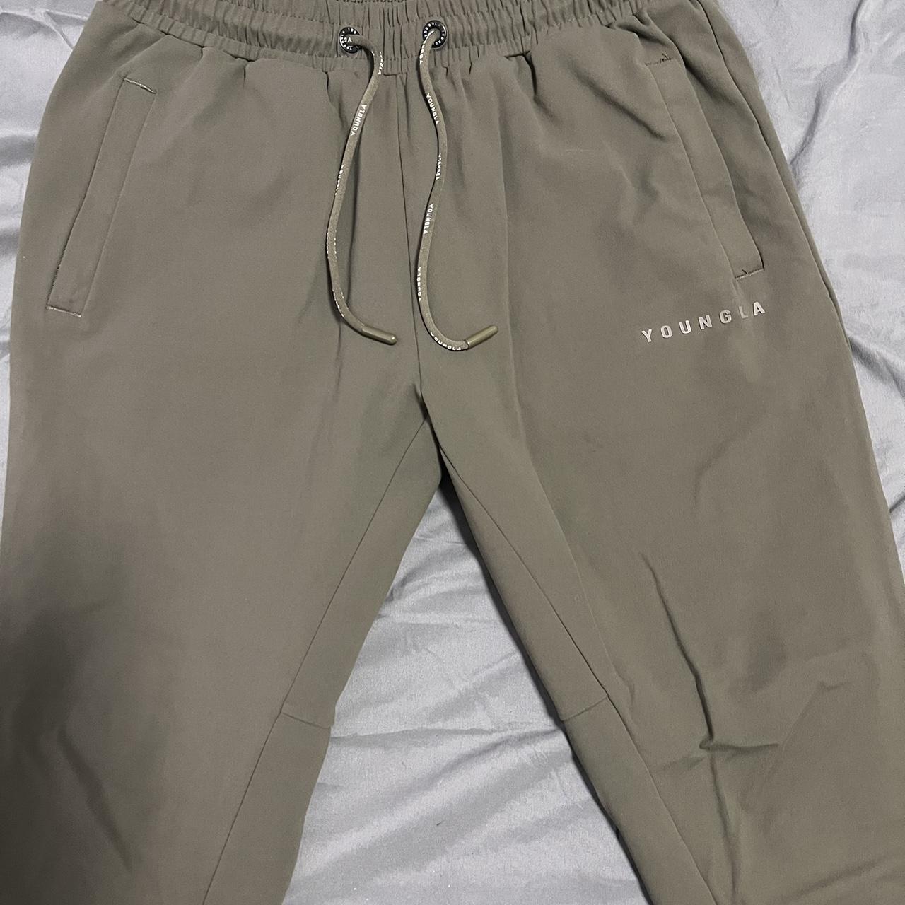 Youngla fitted track pants Medium olive green - Depop