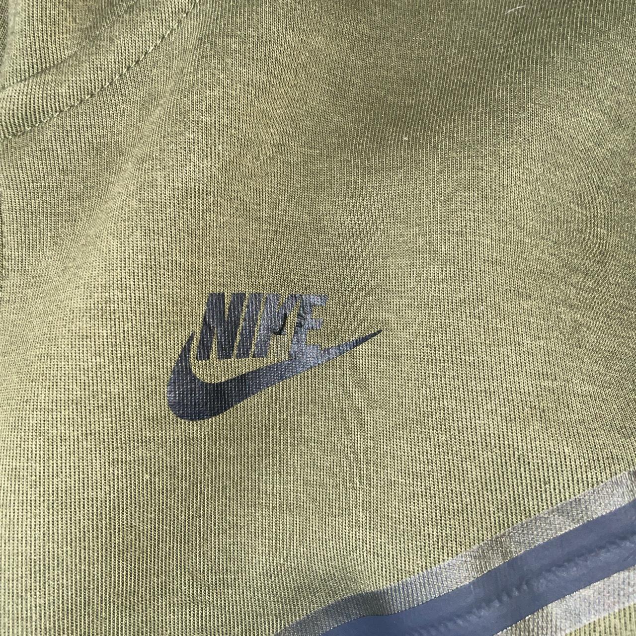 Green Nike tech fleece jacket in a xs minor defect... - Depop