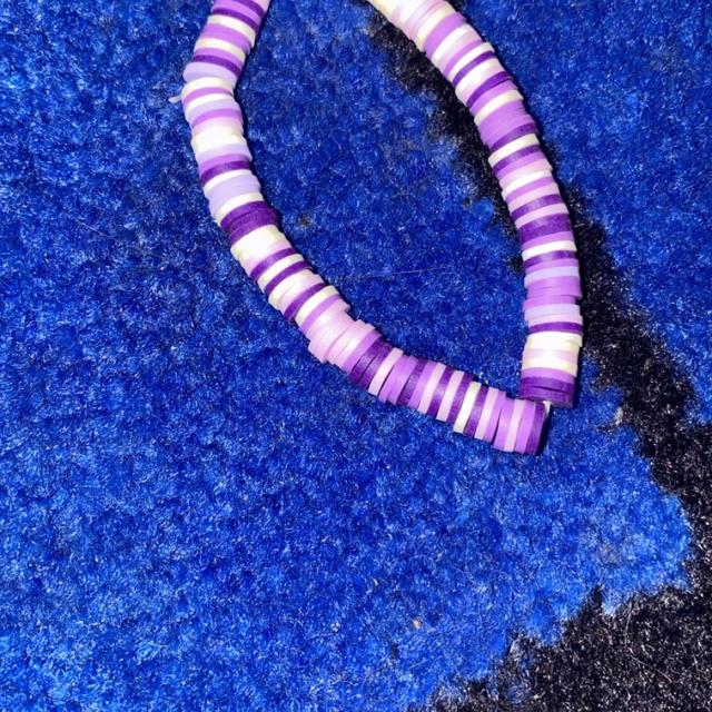 clay beads bracelets. one is purple with a flower - Depop