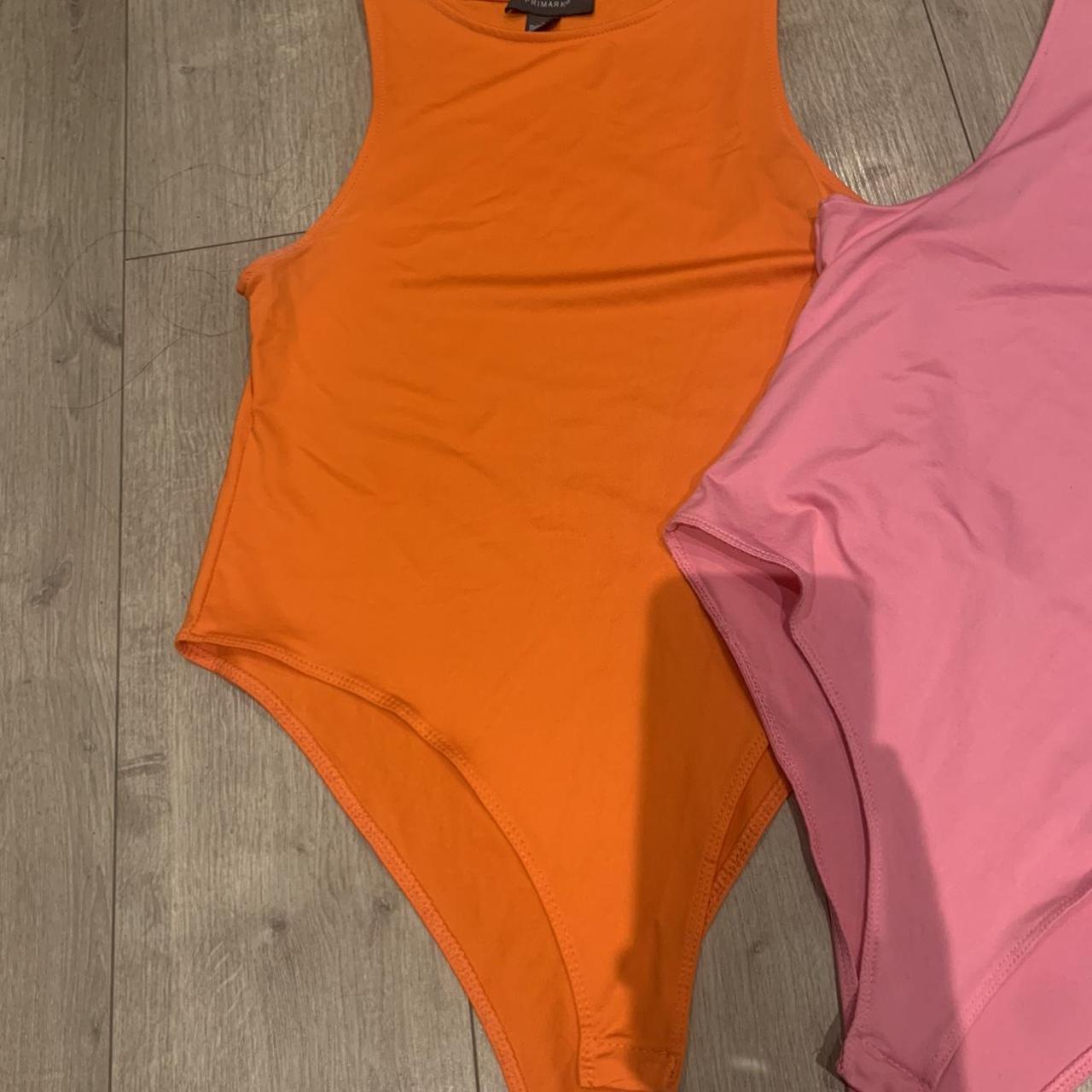 Bundle of 3 bodysuits all worn once great condition - Depop