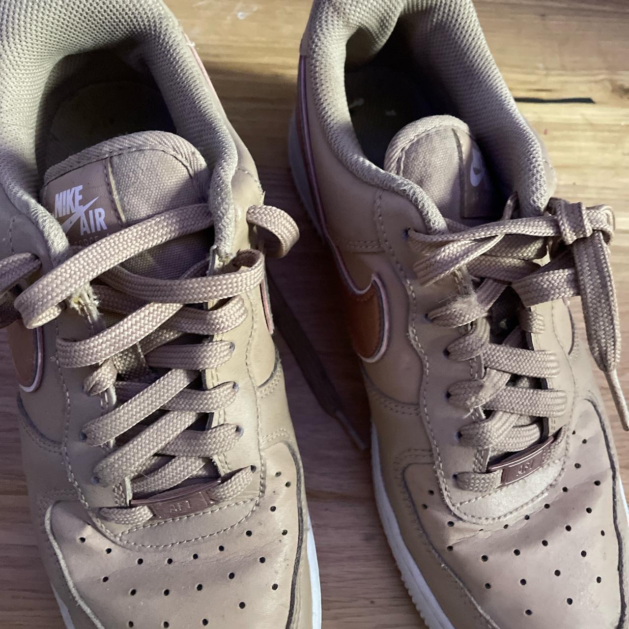 beige and brown nike shoes