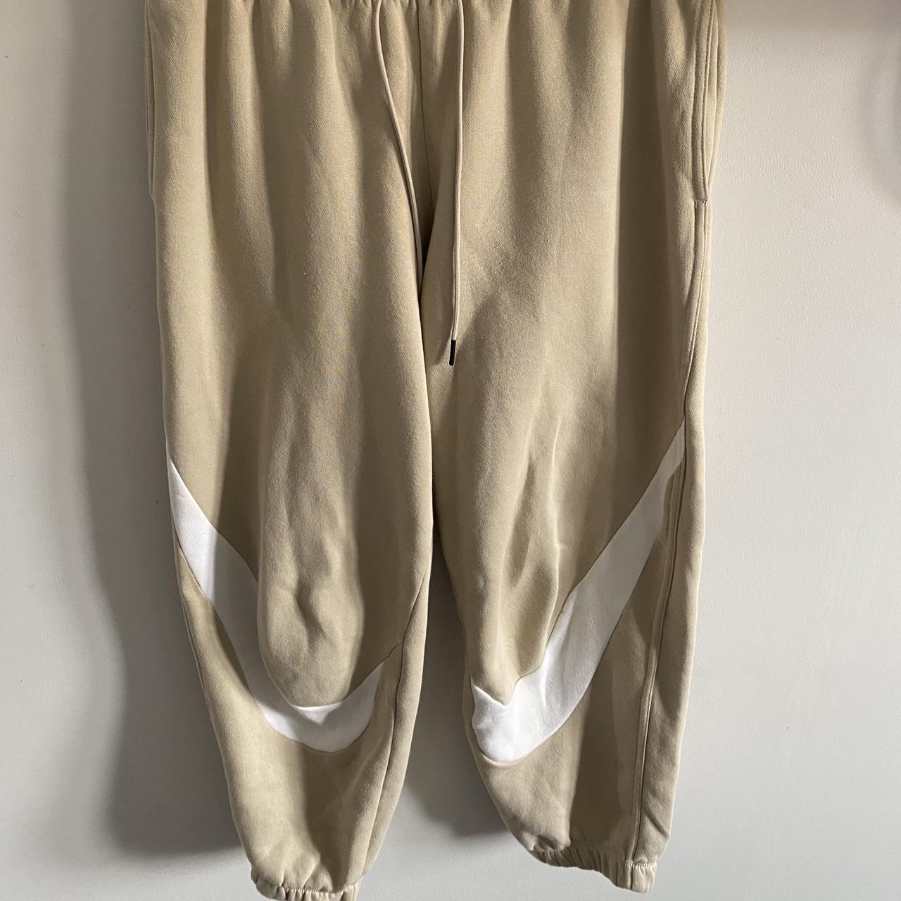 nike swoosh beige joggers