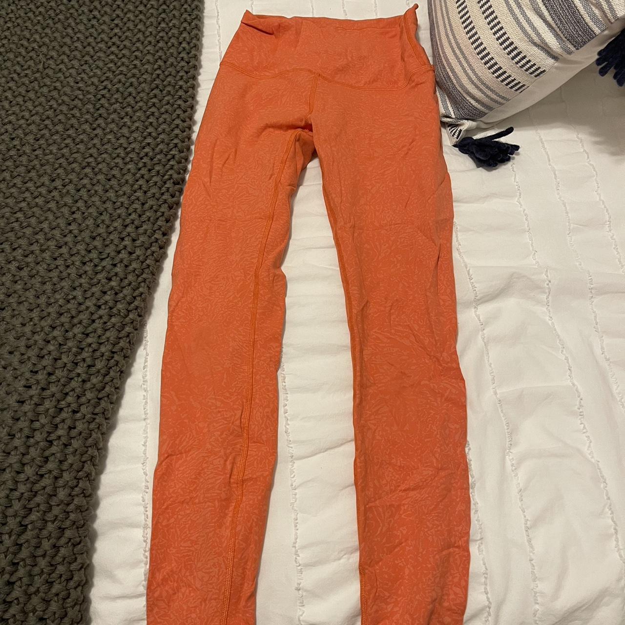 Size 4 orange printed lululemon leggings Depop