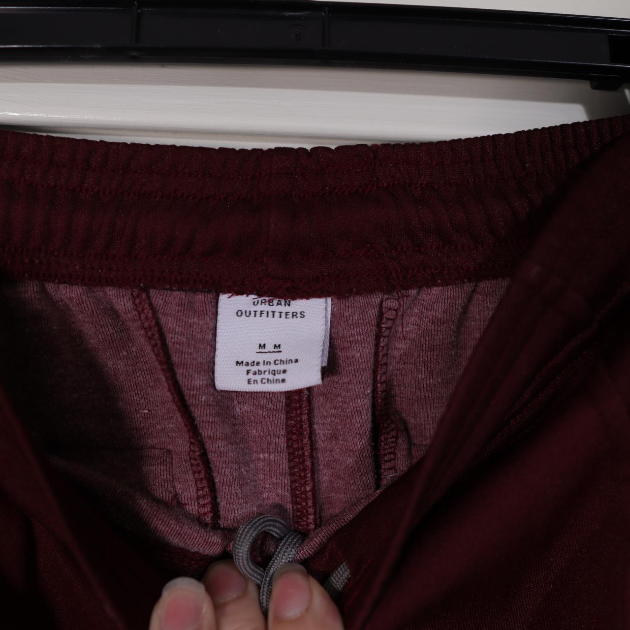 Men's Urban Outfitters burgundy taped track pants... Depop