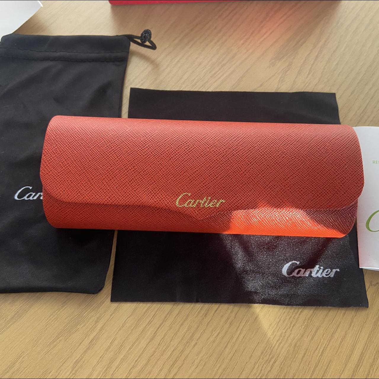 Red Cartier glasses. Used a bit but is still fine.... Depop