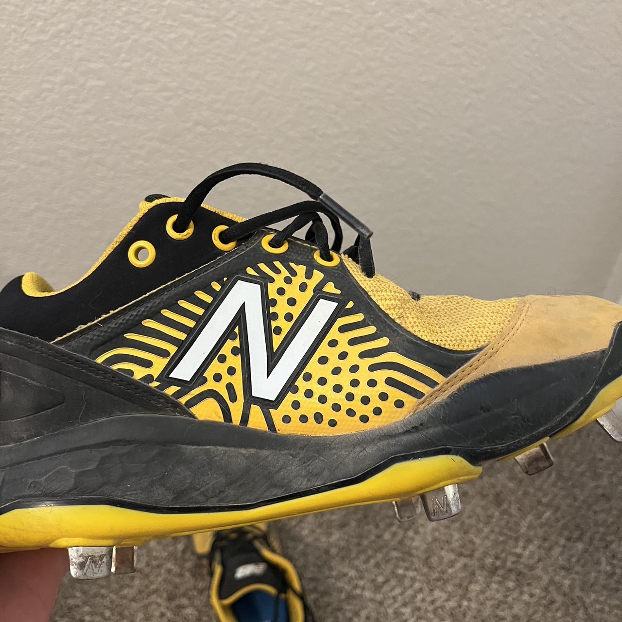 black and yellow baseball cleats