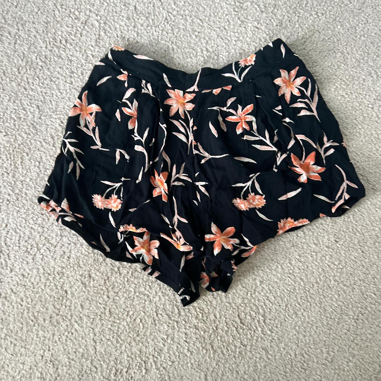 billabong, black shorts with orange flowers,