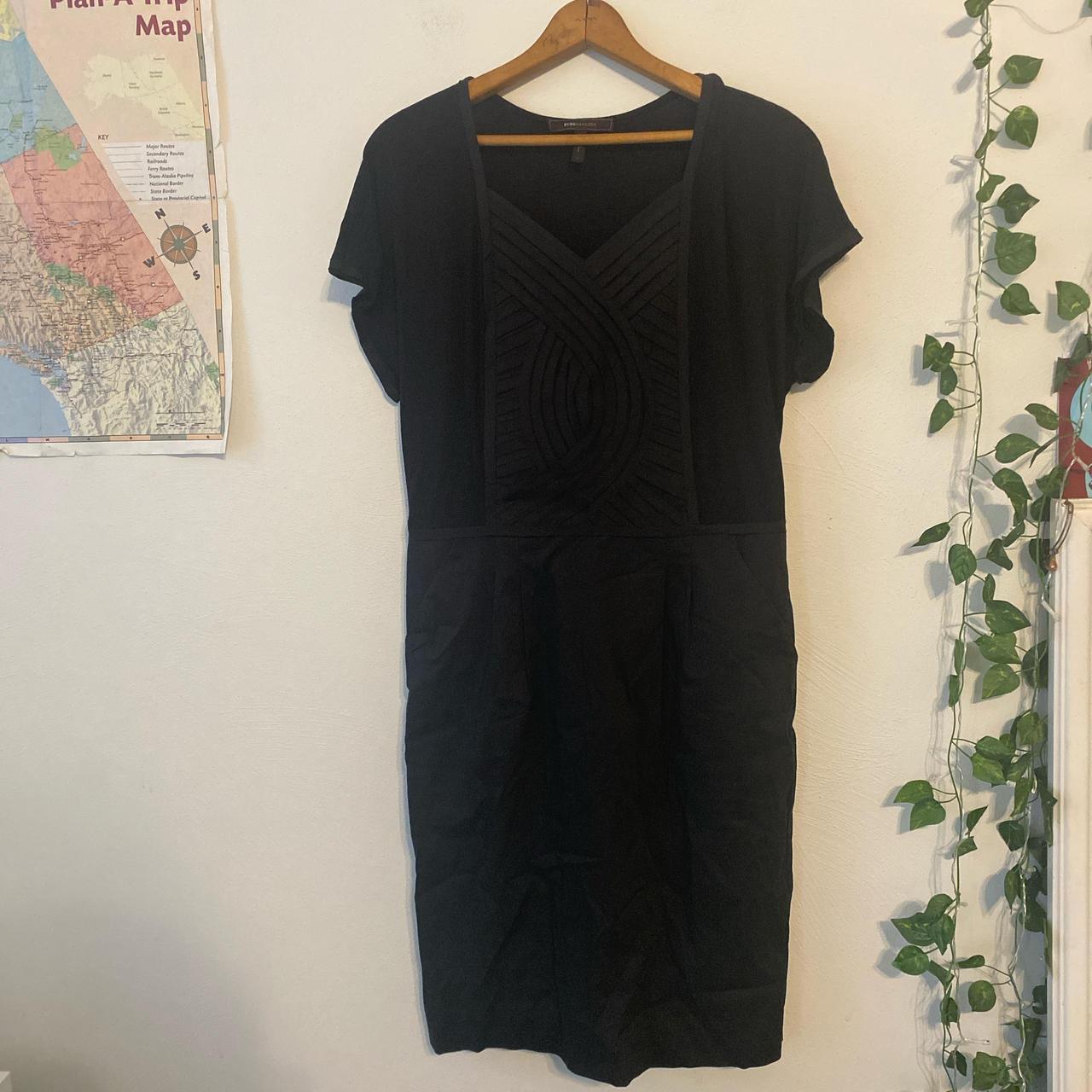 Black near new BCBG dress with pockets. Waist