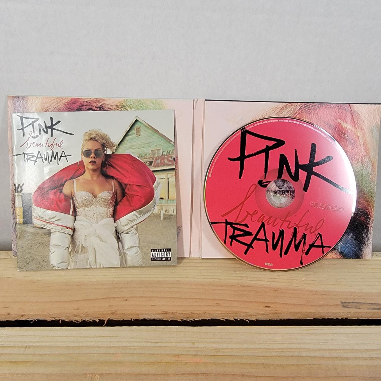 CD Pink Beautiful Trauma. The booklet has been damp