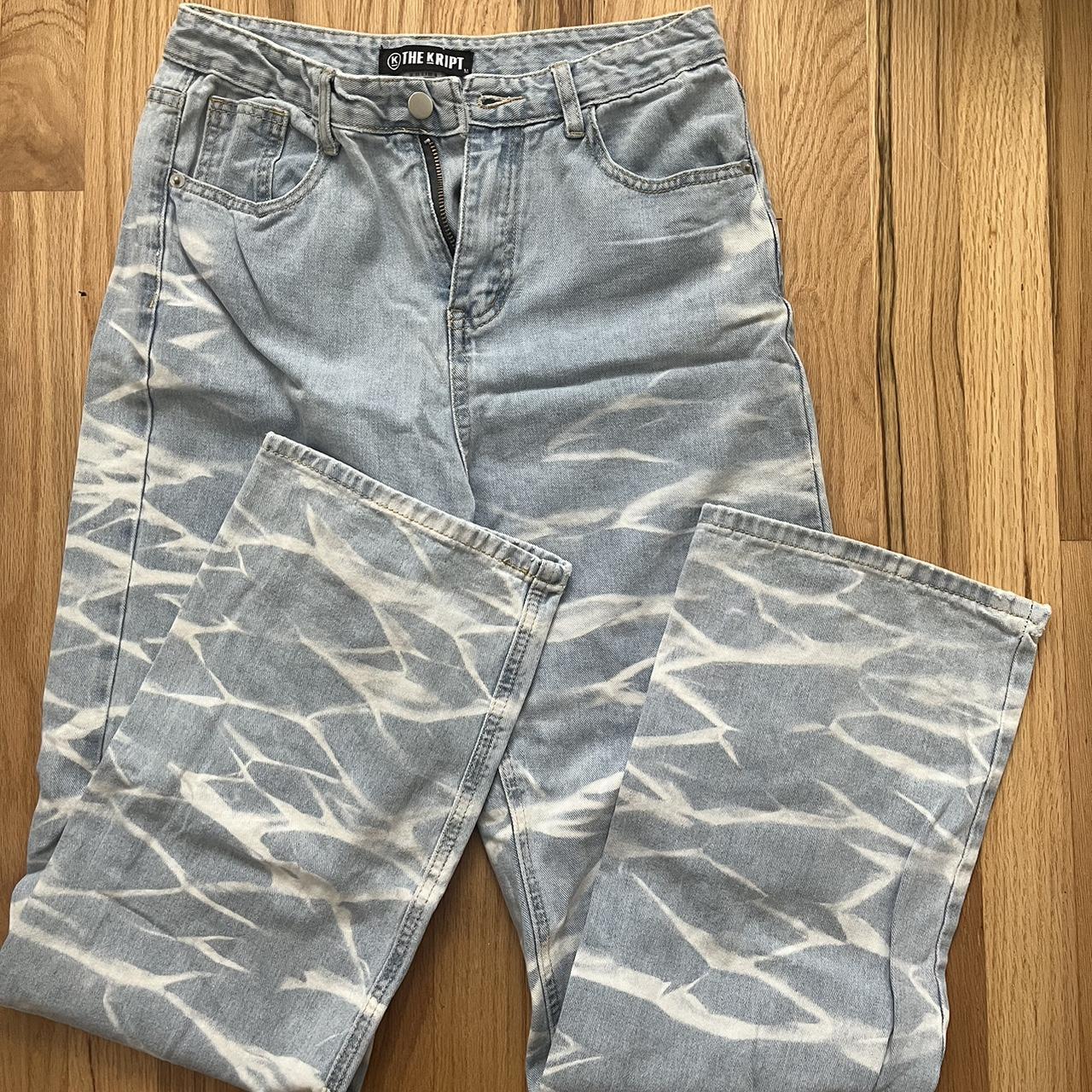 The Kript Jeans Light wash with white design on... - Depop