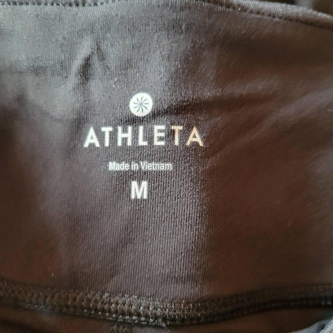 Athleta leggings with criss cross cut out on back of - Depop