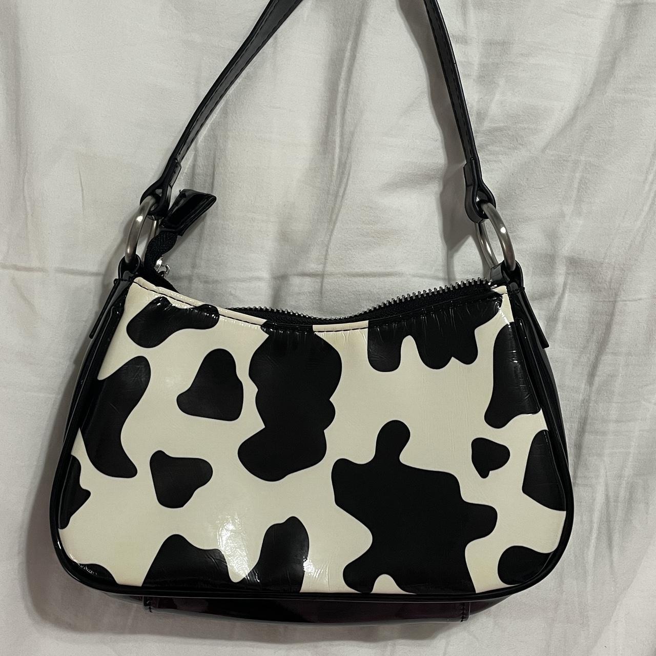 Delia’s hand purse in a cute cow print Purse is... - Depop
