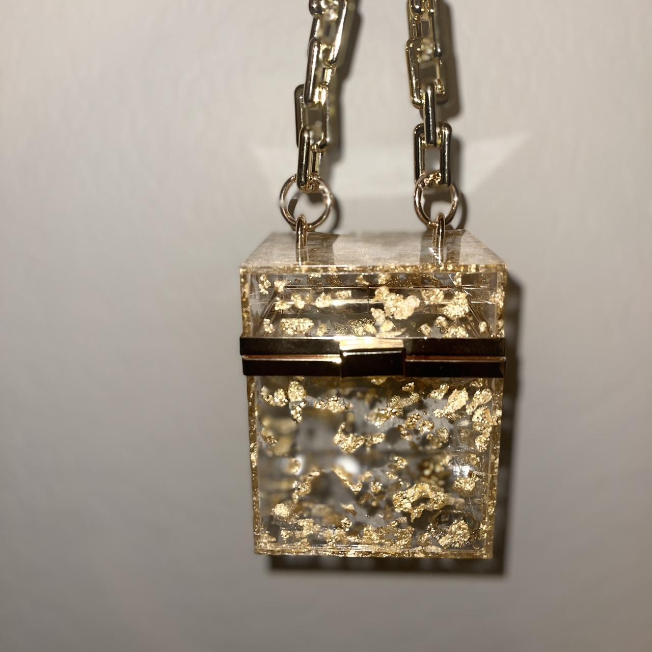 Gold acrylic purse with gold flakes. Gold chain... - Depop