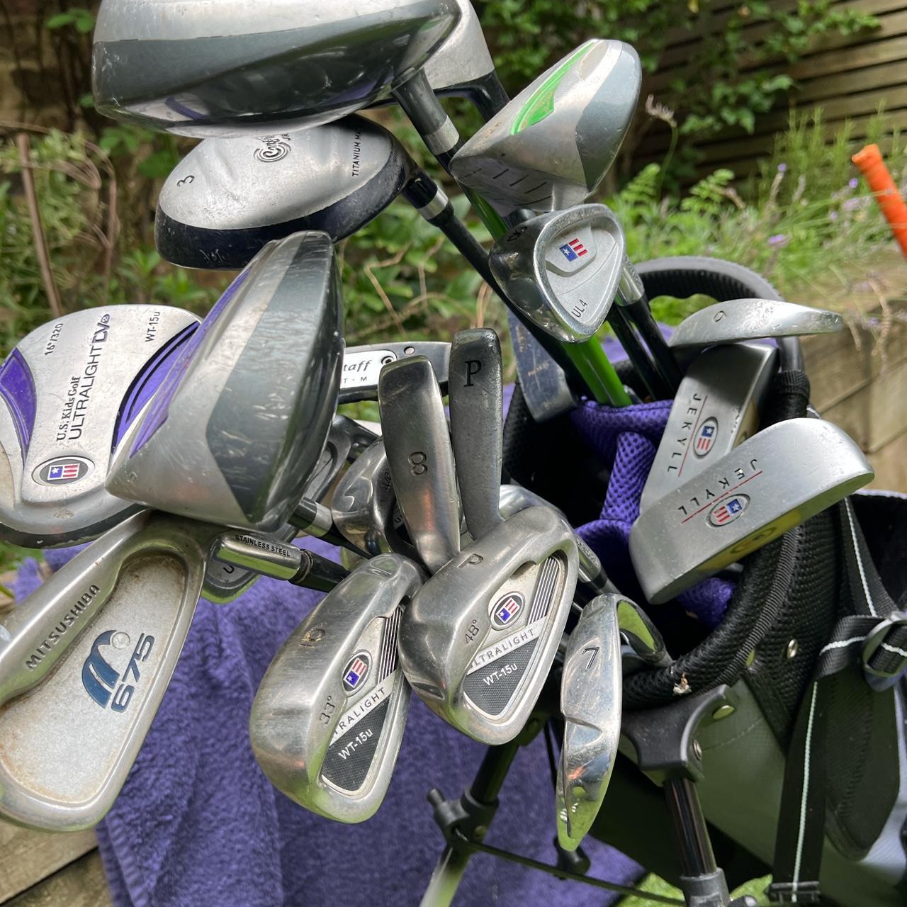 Assortment of us kids golf clubs and bag with cover depop